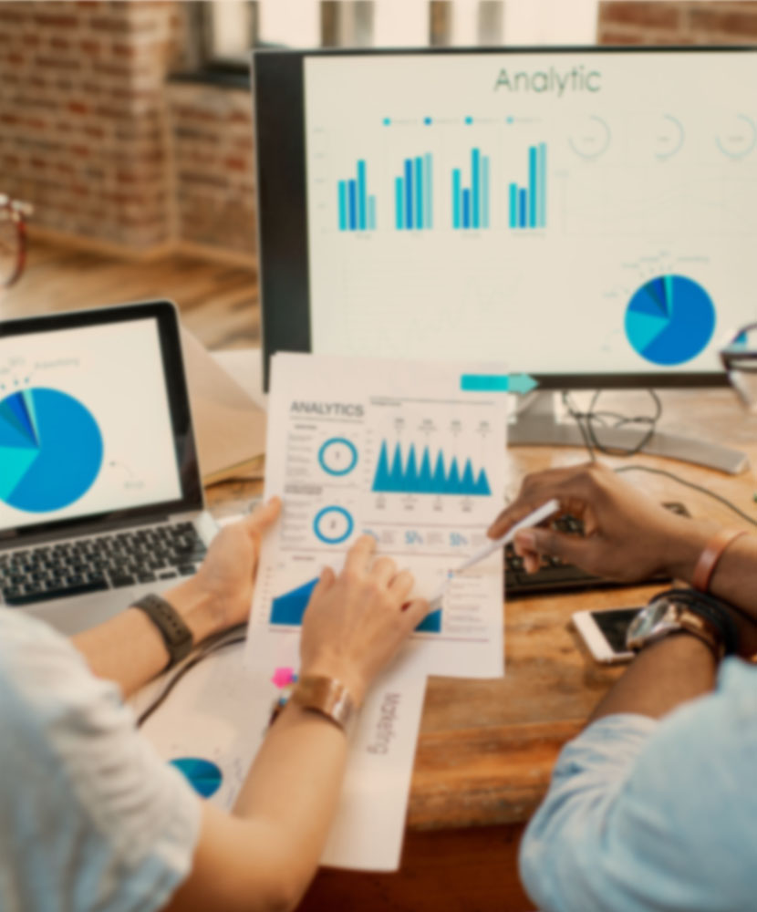 Professionals analyzing people analytics with charts and graphs, making data-driven decisions for business insights
