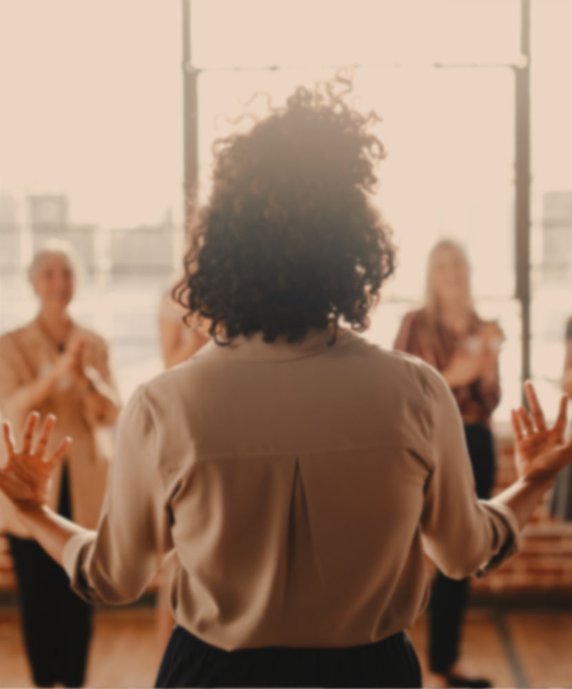 Leadership coaching session with a facilitator guiding individuals towards personal and professional growth