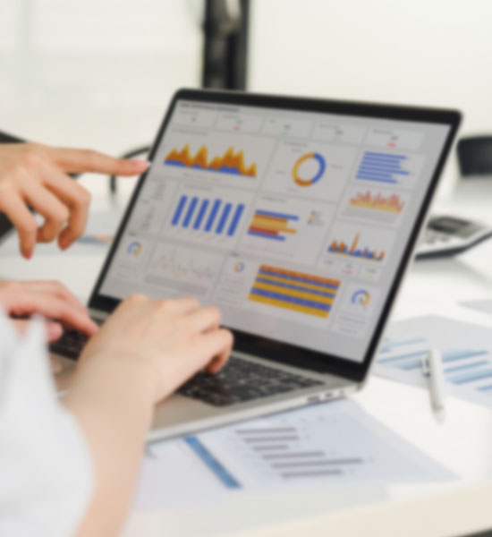 Professionals analyzing people analytics with charts and graphs, making data-driven decisions for business insights